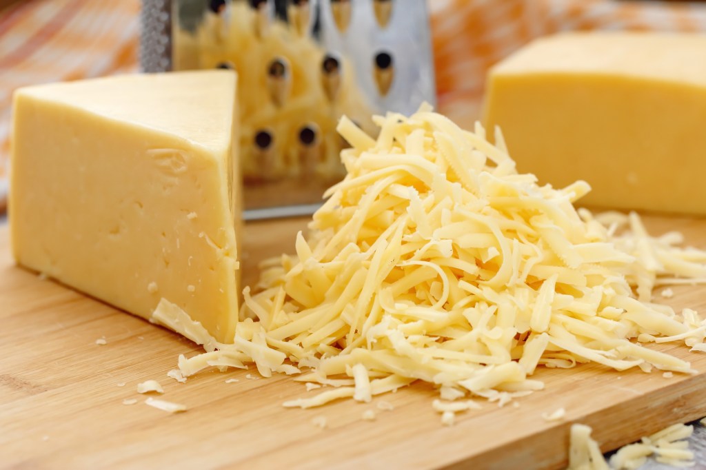 Minced cheese scattered on a wooden table