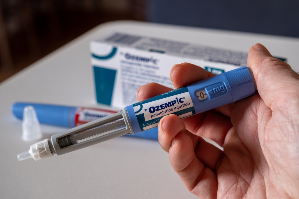 Hand holding an ozepic semaglutide injection pen for the treatment of overweight in Montreal, Ca on November 25, 2023